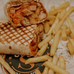 fries and burger on white ceramic plate